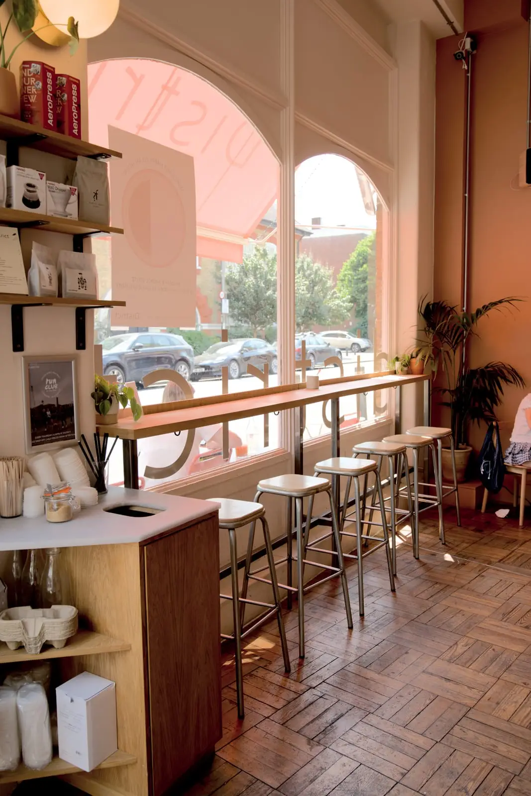 The high countertop and stools along the window at District